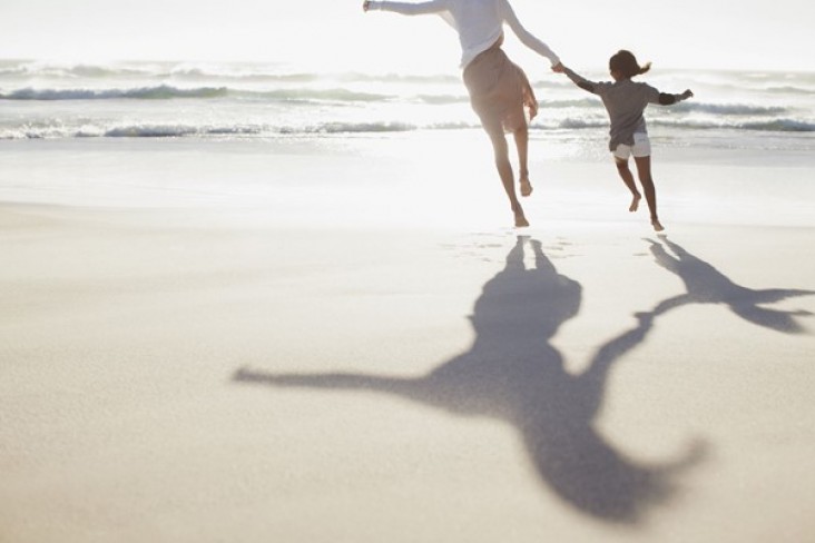 woman and child on a beach