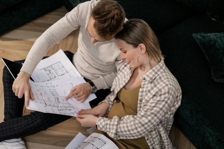 Couple with house plans