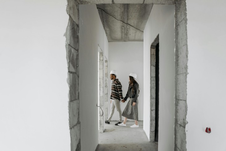 Couple walking through house build